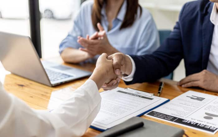 Managers and job applicants shake hands after the job interview