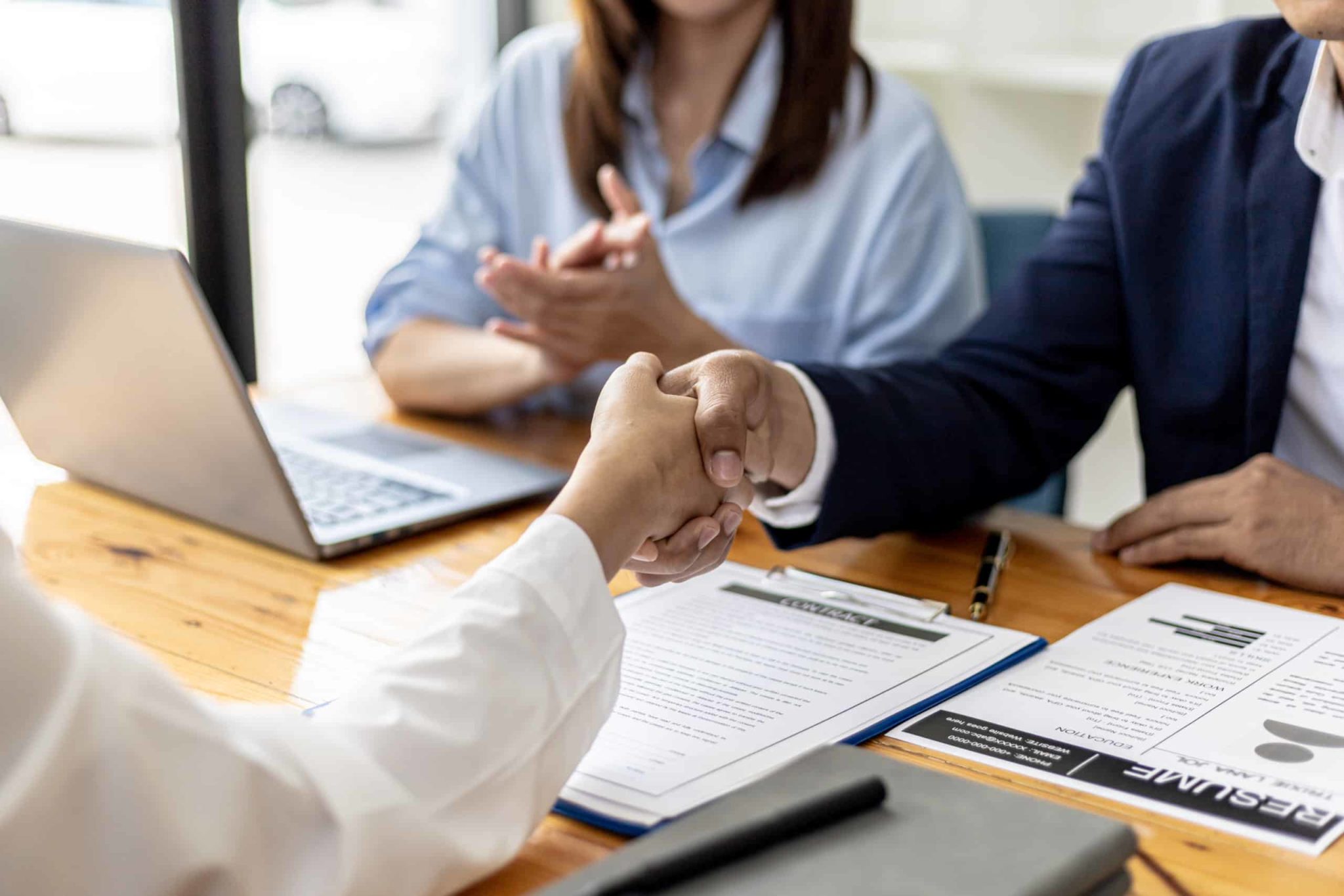 Managers and job applicants shake hands after the job interview